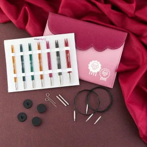 set of different coloured needle tips with pink case
