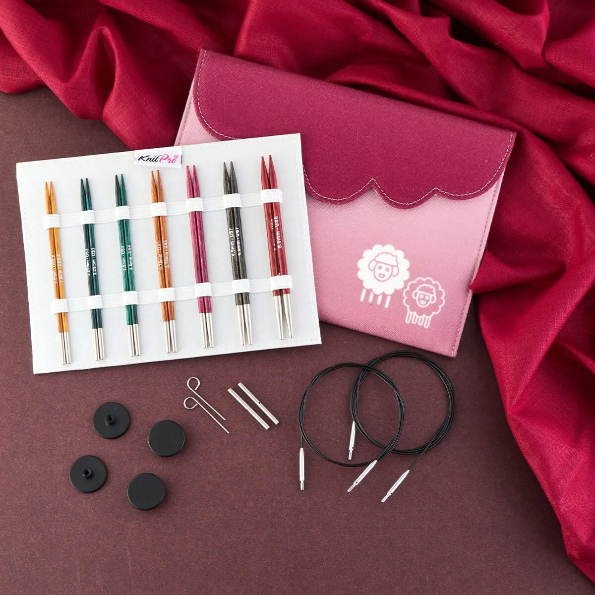 set of different coloured needle tips with pink case