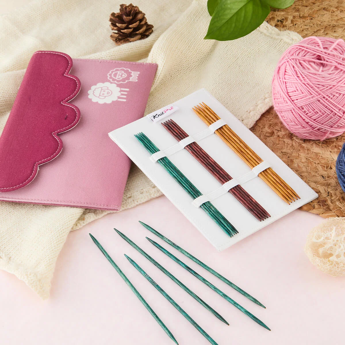 double pointed wood needles in a pink case