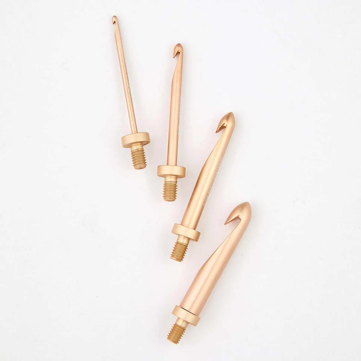 several rose gold coloured Oasis interchangeable crochet hooks