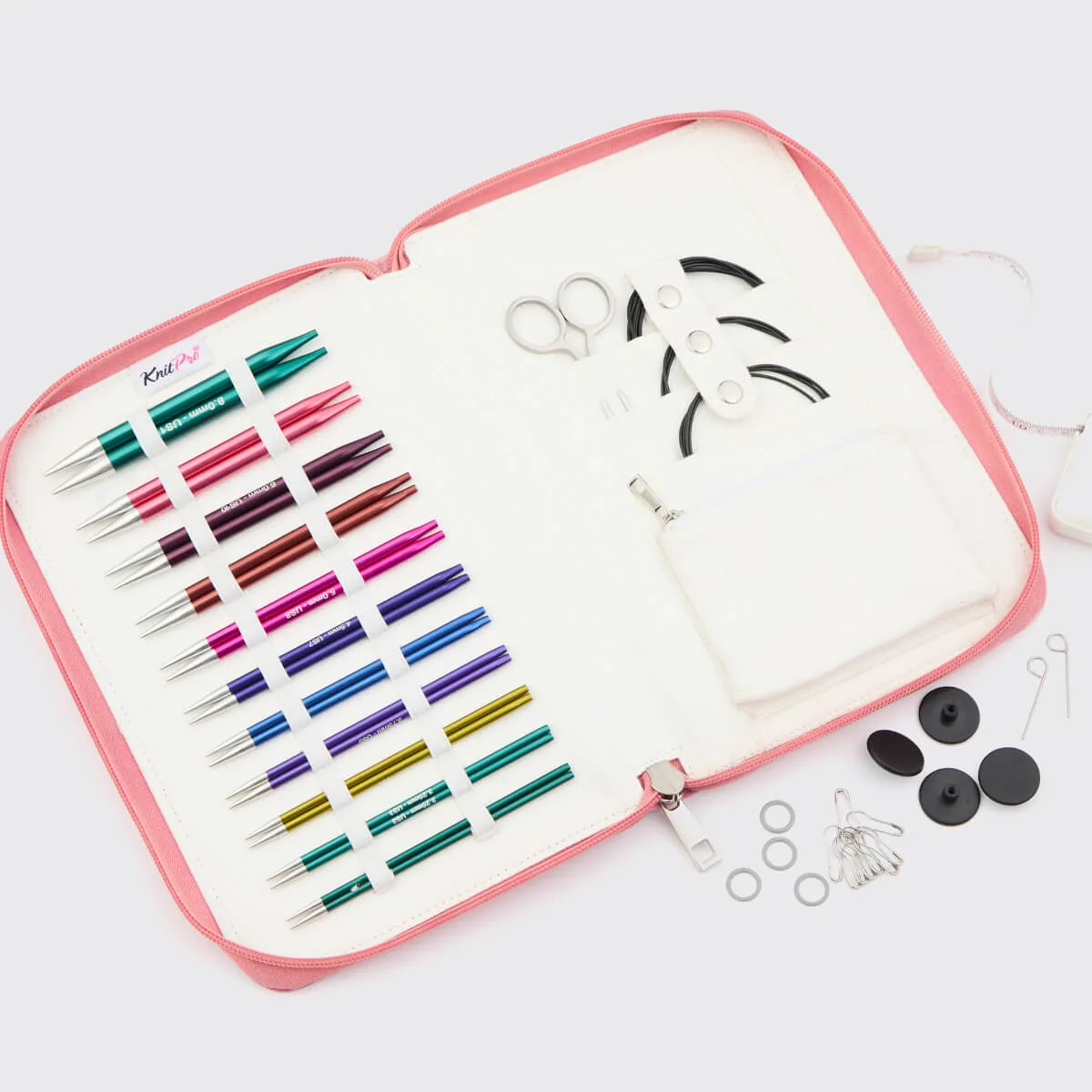 Zing Regal interchangeable needle set with a rainbow of needles and black cables in a pink case.