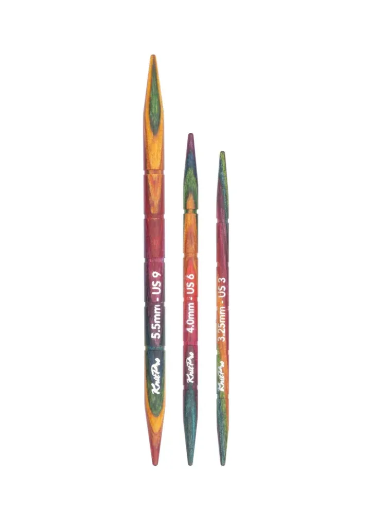 Colourful wooden knitting cable needles set.
